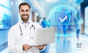 Doctor with laptop in front of a security shield